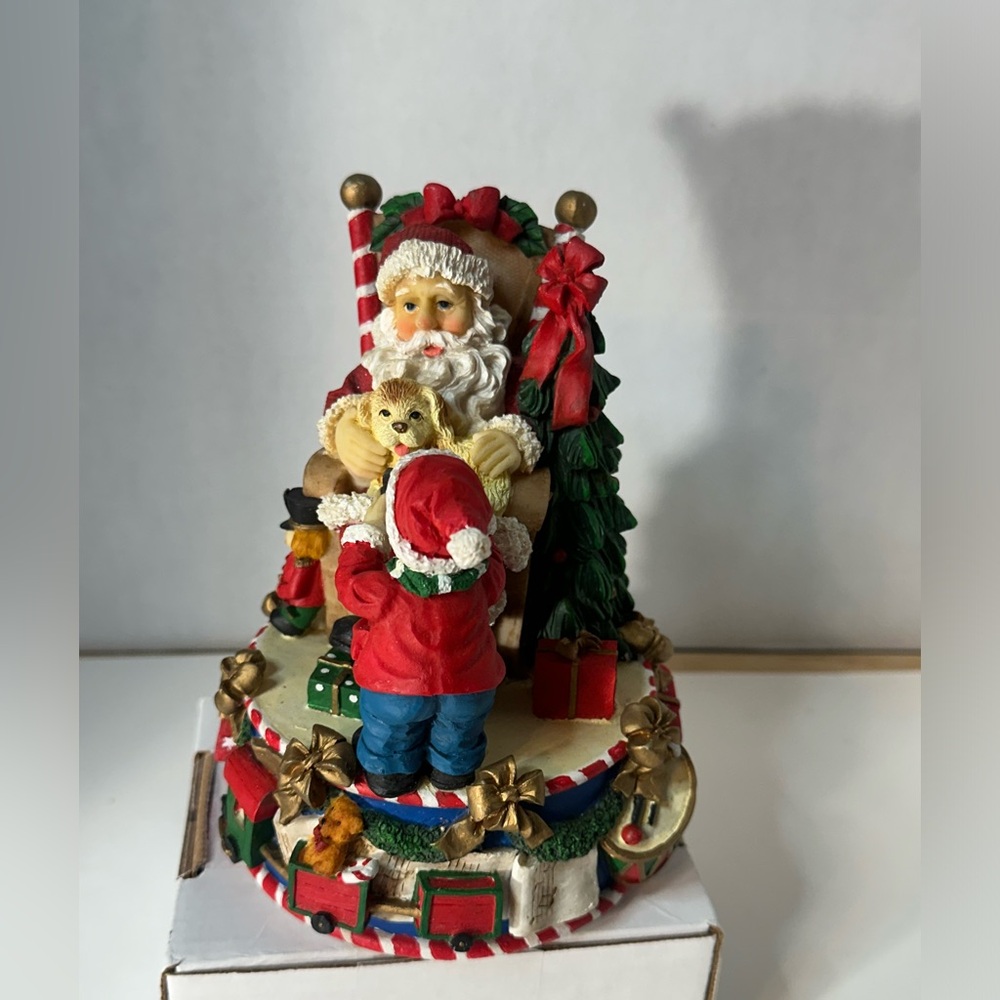 Santa Figureine holding Dog and‎ Talking to Small Child
